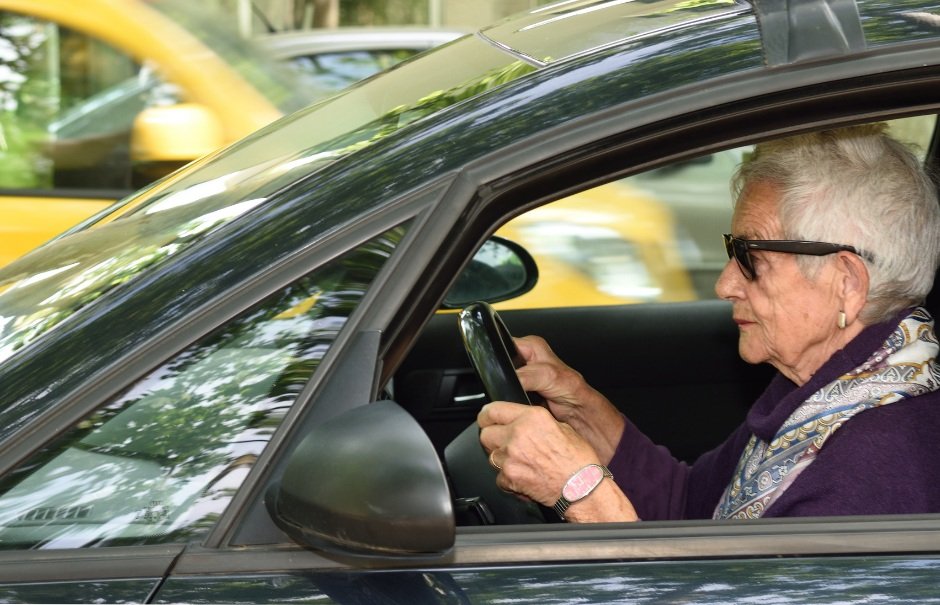 Senior Woman Driving Sedan