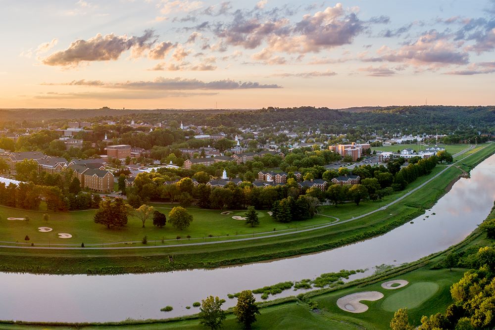 Athens county drone view of Ohio river with town in background
