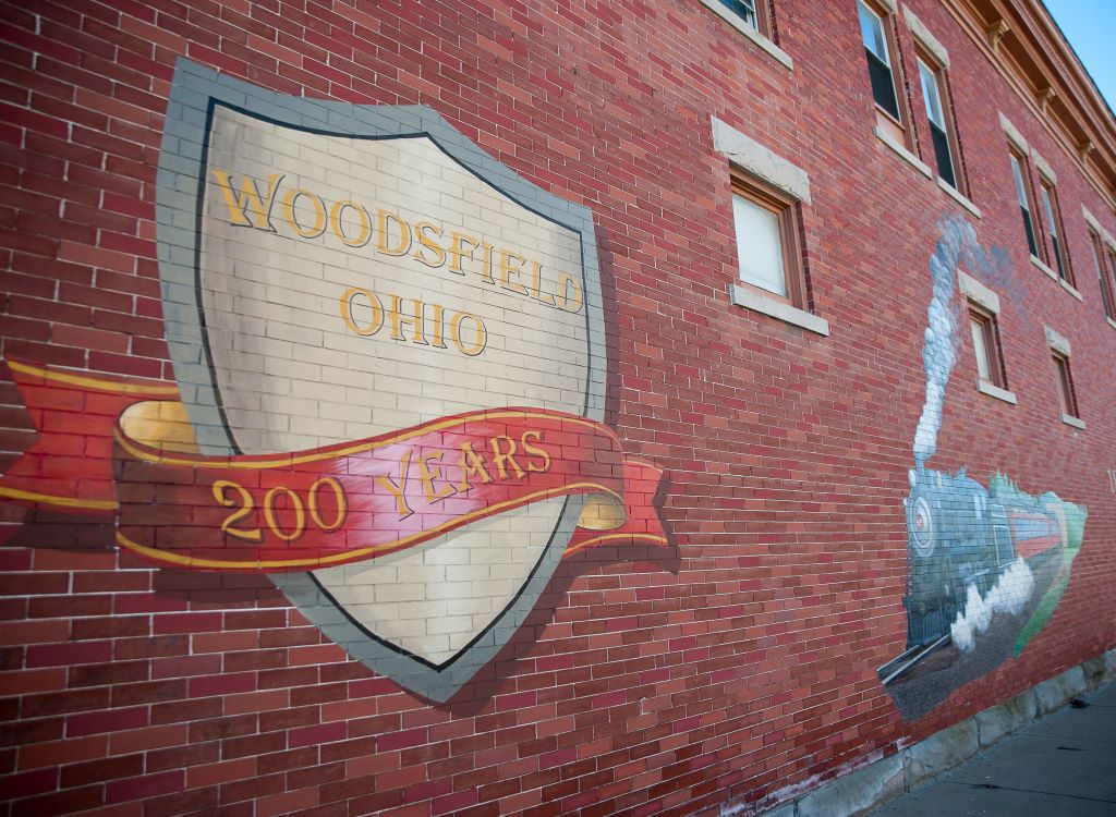 Morgan county brick building with 200 years Woodsfield Ohio and train mural