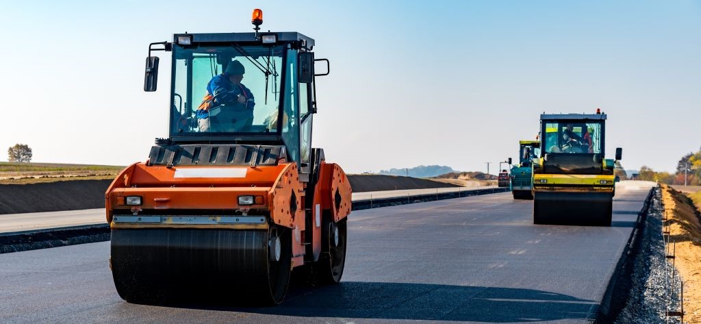 Heavy duty vehicles paving new highway in Ohio