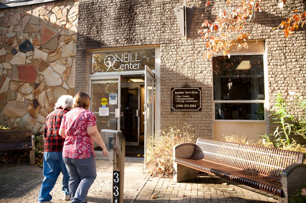 Two adults walk into O'Neill senior services center