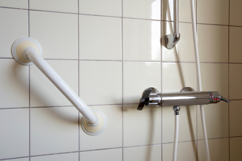 Shower and handrail, grab bar for elderly people at the bathroom