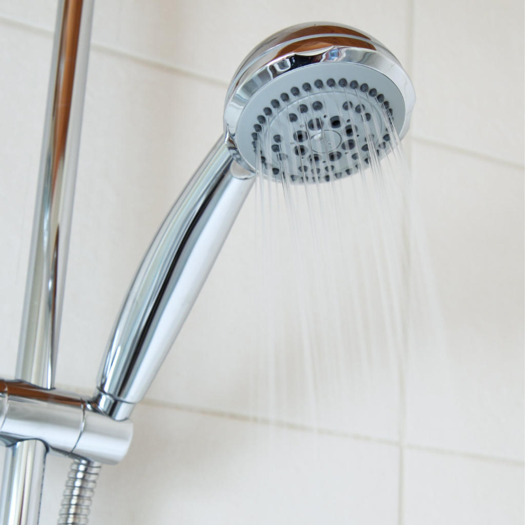 image of shower head with water coming out 