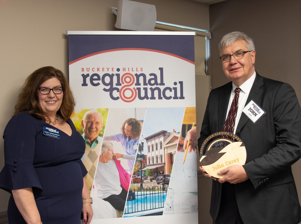 BHRC Executive Director Chasity Schmelzenbach presented Governor's Office of Appalachia Director John Carey with the 2025 Appalachian Service Award.