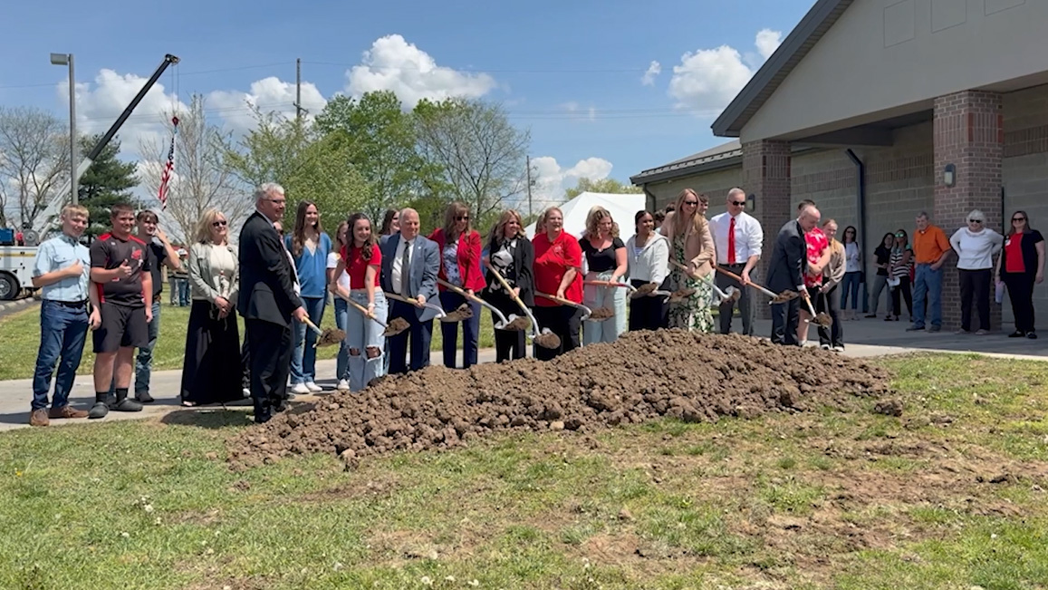 Officials take part in a groundbreaking ceremony