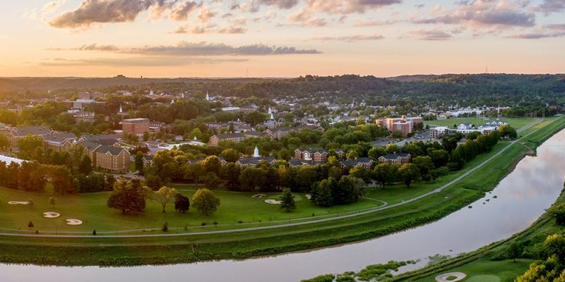 Athens county drone view of Ohio river with town in background