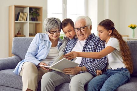 Grandparents read a story to their grandchildren