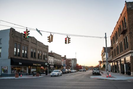 Intersection of small Ohio downtown with traffic lights turning red
