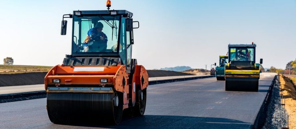 Heavy duty vehicles paving new highway in Ohio
