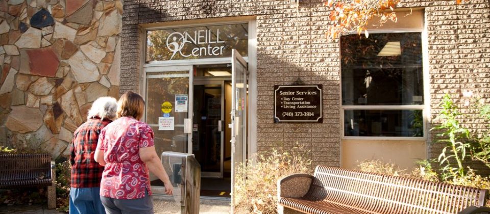 Two adults walk into O'Neill senior services center