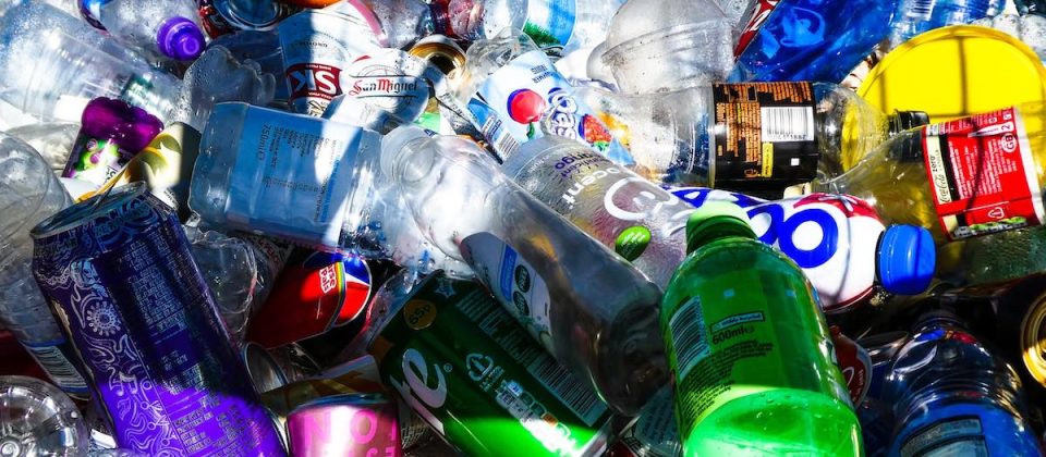Large number of recycled bottles in bin